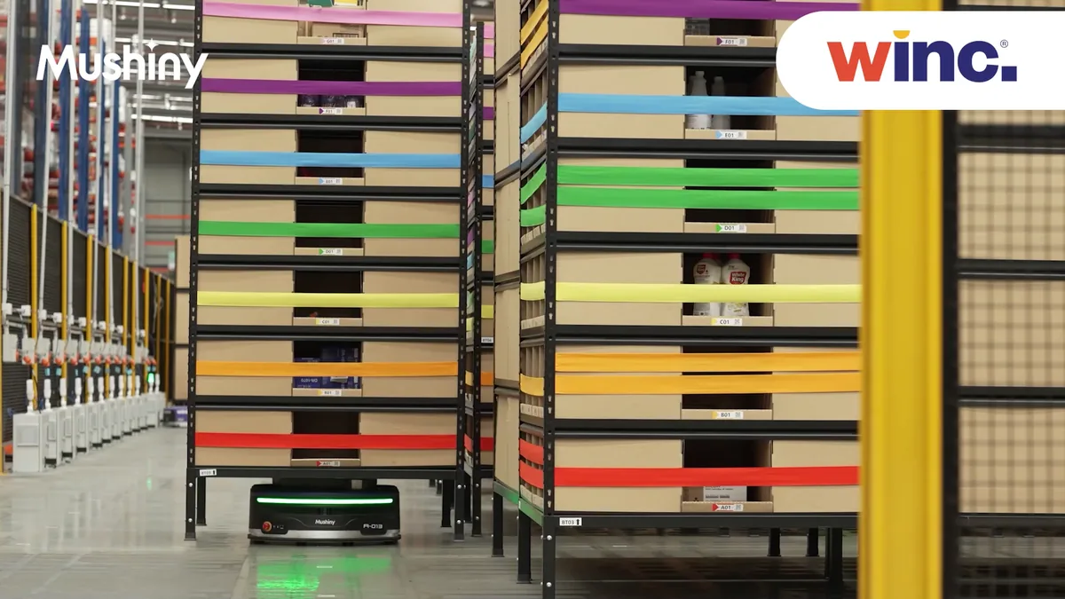Pods of banded stock at Winc, with a Mushiny AMR carrying one out of the rack